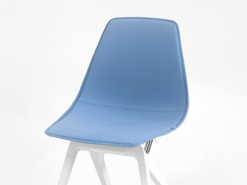 Blue New Zealand Wool topper on a white noho move chair